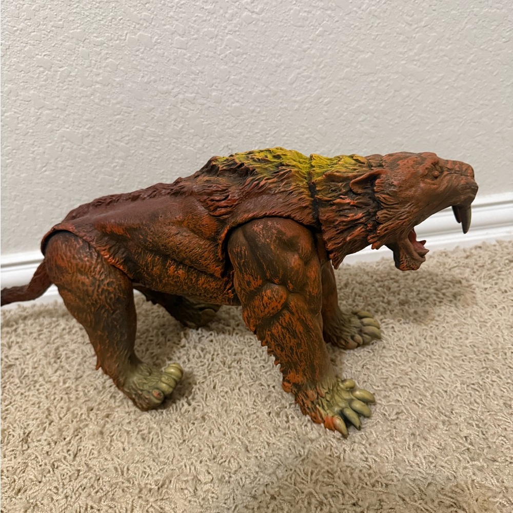 Brown and Green Reptile Toy Figure